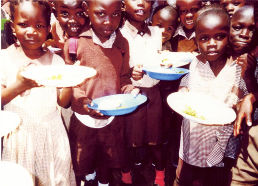 Smiling children with food